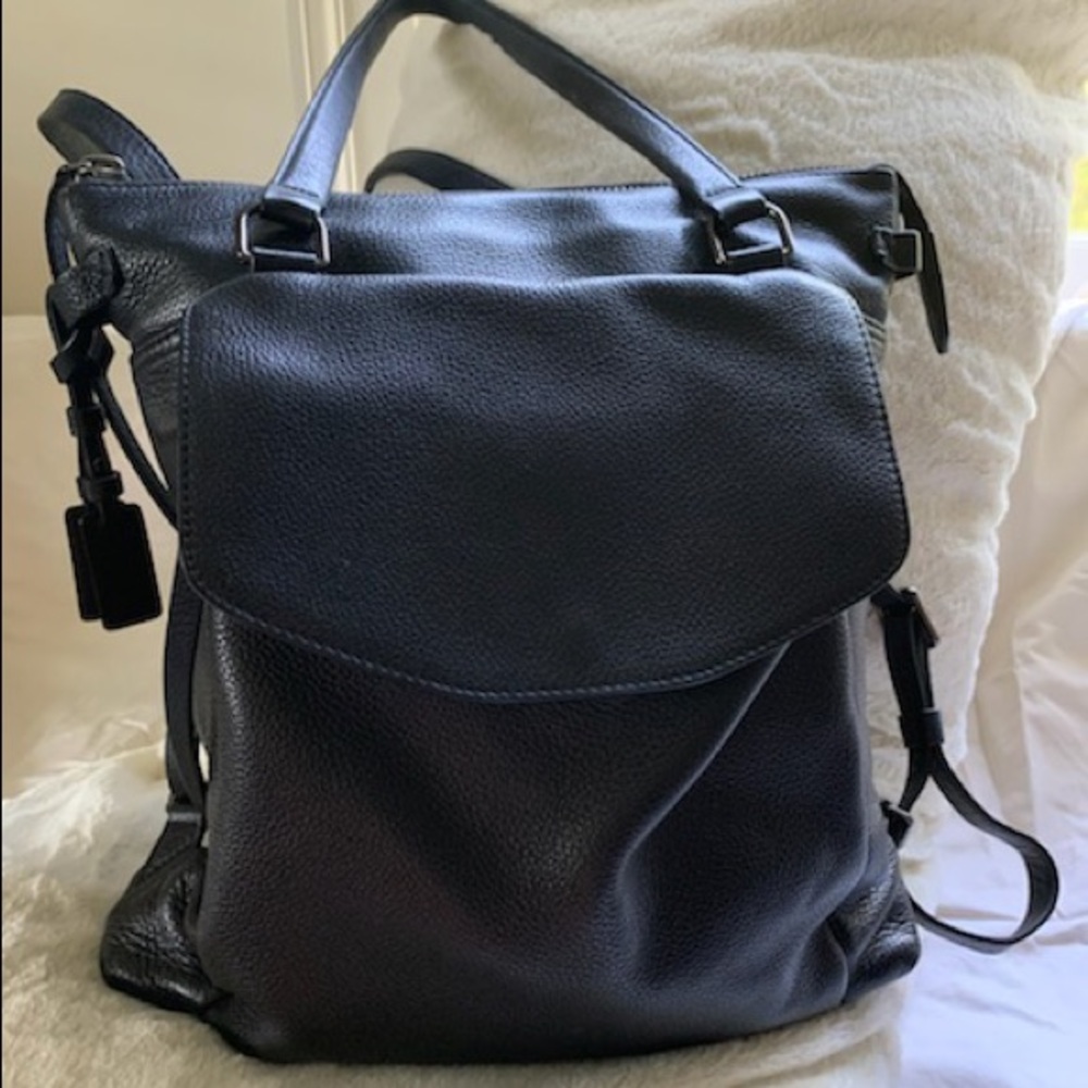 Excellent condition TUMI black leather convertible backpack briefcase.